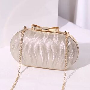 Elegant Gold Clutch with Bow Accent